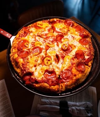 Create Your Own Pizza shown with pepperoni and peppers