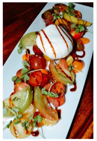 Heirloom Tomato Caprese on a rectangular plate